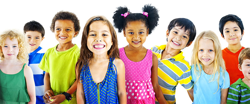 The image shows a diverse group of children posing together with smiles, wearing colorful clothing against a white background.